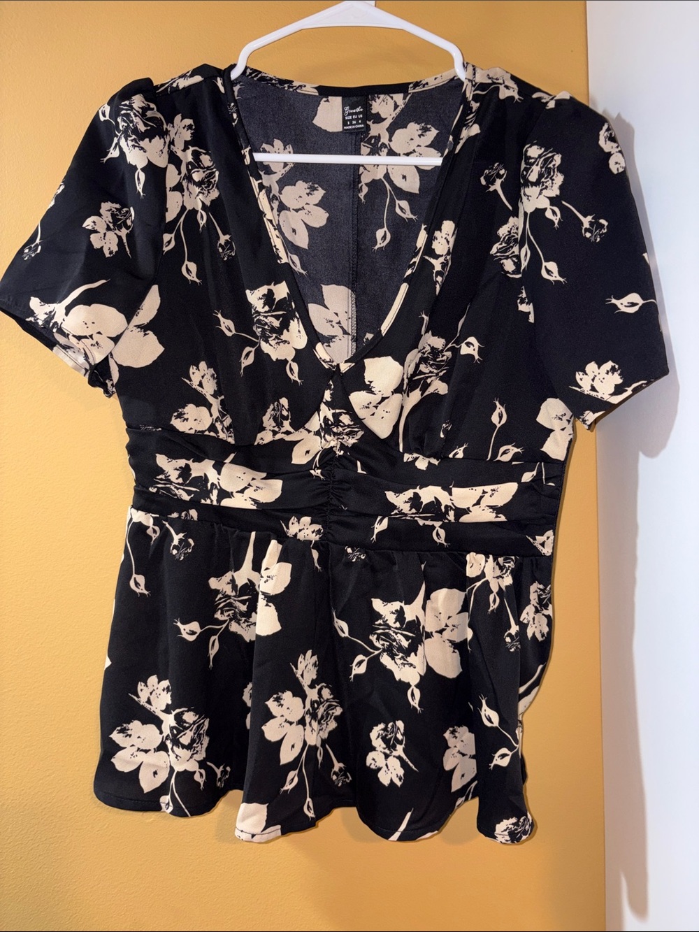 Black Floral V-Neck Peplum Blouse with Cream Print